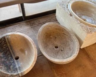 Assorted Stone Basins
An assortment of stone basins in various colors and designs, including polished and textured finishes. These are ideal for home renovations or decorative uses.