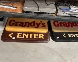     Grandy’s Restaurant Signs
    Vintage “Grandy’s Enter” signs, perfect for collectors of retro restaurant memorabilia or repurposing as décor for a rustic or industrial-style space.