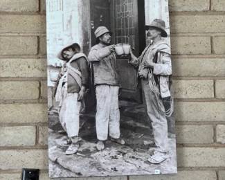 Framed Vintage Artwork
A charming black-and-white vintage photograph depicting a slice of history, beautifully framed and ready to add a touch of nostalgia to your home decor.