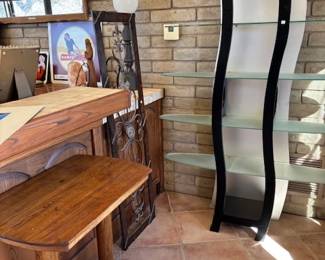 Unique Furniture & Décor
A collection of one-of-a-kind furniture, including a wooden side table, modern curved glass shelving unit, and decorative wrought iron accents. Perfect for both modern and rustic aesthetics.