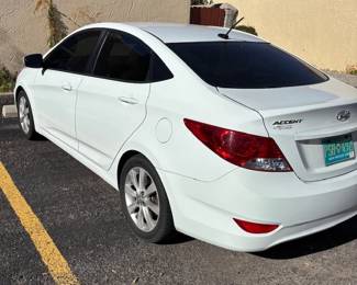 2014 Hyundai Accent - Rear View
A rear view of the Hyundai Accent showcasing its aerodynamic design, LED tail lights, and spacious trunk. Ready for its next owner!