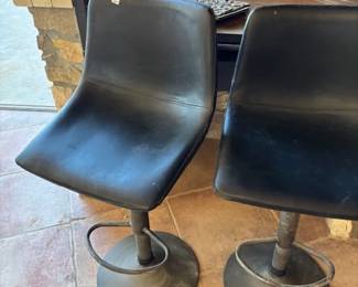 Black Leather Barstools
A pair of sleek black leather barstools with a modern design. These are both functional and stylish, ideal for kitchen islands or bar setups.