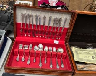     Silverware Set in Wooden Case
    A complete silverware set with ornate designs, elegantly displayed in a red velvet-lined wooden case. Ideal for formal dining or as a collectible.