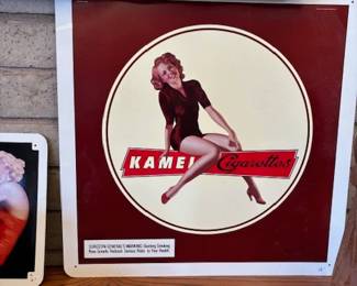Retro Kamel Cigarette Advertisement
A striking retro advertisement for Kamel Cigarettes, featuring vibrant colors and pin-up art. Perfect for collectors of vintage advertising memorabilia.