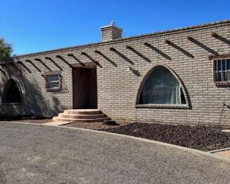 Exterior of the Property
For sale: A beautiful mid-century brick home located in Las Cruces, showcasing unique architectural features such as elegant arched windows and a welcoming front entrance. This property offers timeless charm and is conveniently situated between Avenida de Mesilla and Main Street. For inquiries, please contact Crystal McCaslin at 575-571-1229.