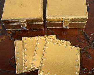 Set of 4 gold coasters in carrying case, 2 sets available, was $7 each, NOW $5 each