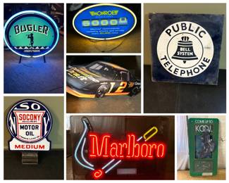 A large collection of neon signs, light boxes and vintage advertising signs.