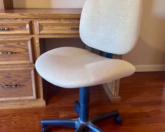 Rolling and swiveling office chair