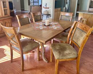 Smooth wood dining table with 6 chairs
