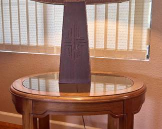 metal table lamp and round glass-top table
