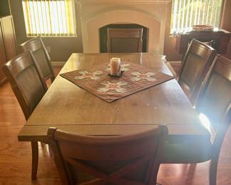 Smooth wood dining table with 6 chairs