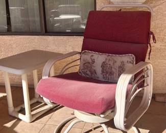 Outdoor swiveling armchair