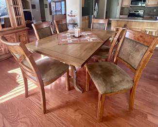 Smooth wood dining table with 6 chairs