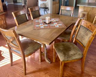 Smooth wood dining table with 6 chairs