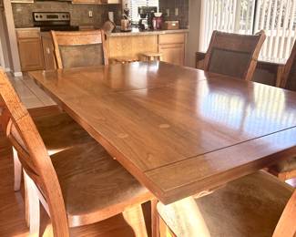Smooth wood dining table with 6 chairs