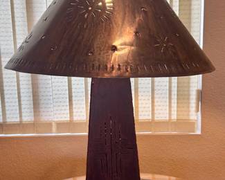 metal table lamp and round glass-top table