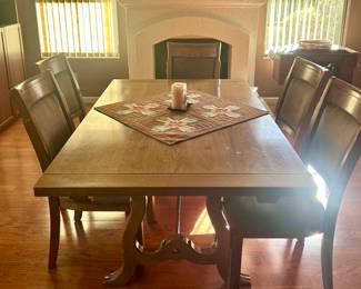 Smooth wood dining table with 6 chairs