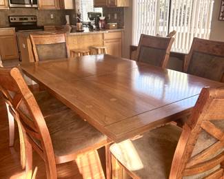 Smooth wood dining table with 6 chairs
