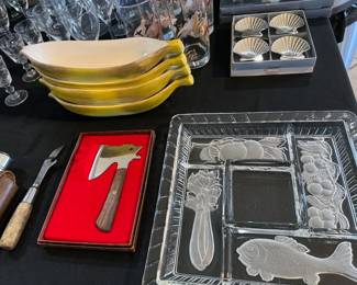 Assorted cheese knives, glass plates, banana sundae boats