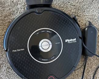 Assorted vacuum cleaners, including Roomba