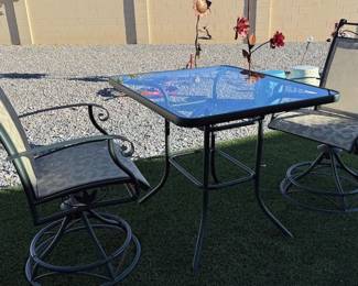 Square glass table with 2 swivel chairs