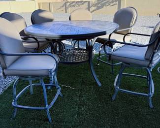 Round bar height table with 6 swivel chairs