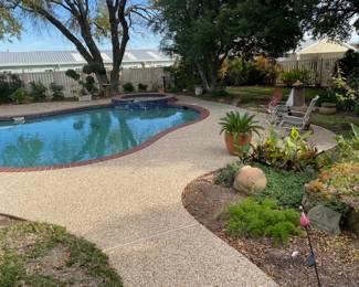 PICS OF THE POOL AREA WITH LOTS OF PLANTERS AND MORE