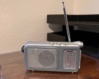 Portable radio with flashlight 