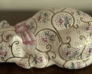 Cat with pink flowers figurine