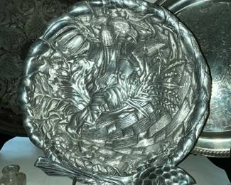 Ornate aluminum serving plates