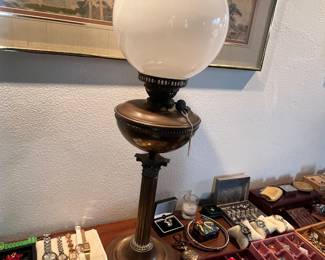 Tall antique oil lamp