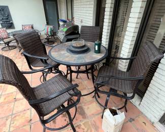The back patio. Slate-top table w/ 4 swivel chairs