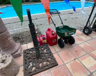 Umbrella base, spreader, gas cans