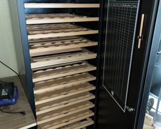 Inside has sliding wine trays