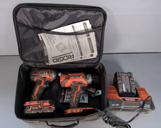 Ridgid 1/4" Impact Driver, Model R86034, And Ridgid Drill, Model 860054, With 18V Batteries, Qty 2, And Battery Charger, Owners Manual For Impact Driver And Charger, Contents Of Carry Case 