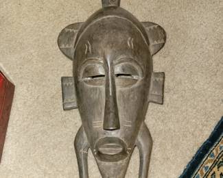 Carves wood African mask