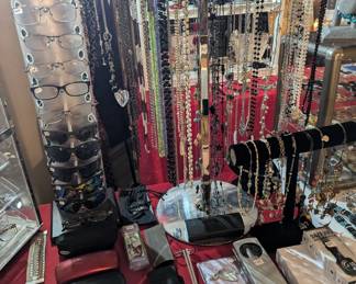 Sunglasses, glasses, necklaces, money clips, Zippo lighter