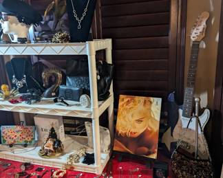 Guitar, necklaces, Madonna, George magazines, Brighton purses