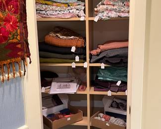 Fabric, needlepoint kits, knitting supplies for sale during in-person shopping.