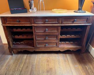 $860. Stone topped Milling Road wine cabinet originally purchased at Masin's Furniture for $2400. 59.5"w x 18"d x 32.5"h. Available during online shopping starting at 6pm on Wednesday per the instructions in the sale description.