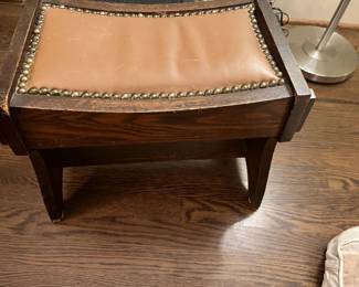 $48 Leather inlay with brass tacks and wood framing. 16.5"w x 10"d x 15"h. Available during in-perosn shopping Friday and Saturday.