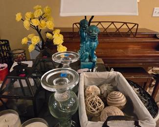 A segment of foo dog lamps, candle holders, lots of candles all for low prices!