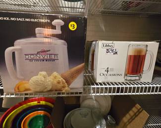 2 boxes of beer mugs containg 4 mugs in each box & 2 old fashioned ice cream makers!