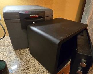 2 safes priced to move! The larger is fire proof & holds hanging files & selling for $20