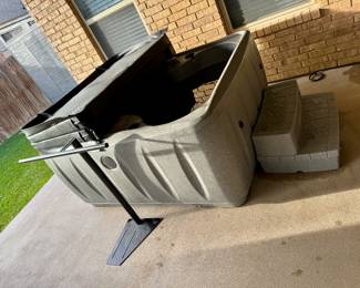 Hot tub with stairs with storage, towel rack, snack tray,  new filter and chemicals.  1 year old.  $2000