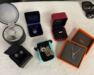 Women’s jewelry. This is all the jewelry we have! 

Chanel earrings, Tiffany necklace, Hermes, Cartier ring, tag watch