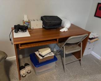 Desk with bookshelf (not shown)