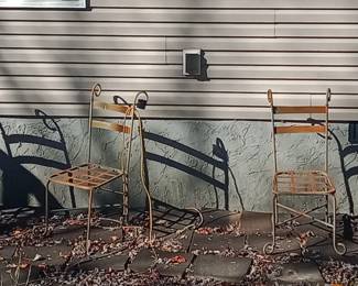 3 chairs that go to a metal/wrought iron glass top table