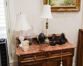 Marble top cabinet, book end sets, lamps and framed art