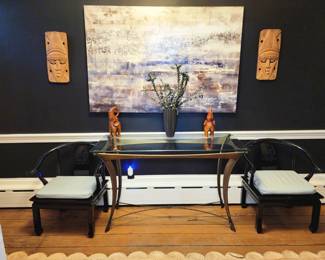 2 black Japanese style chairs, heavy console with chrome base, wall art, Asian masks.